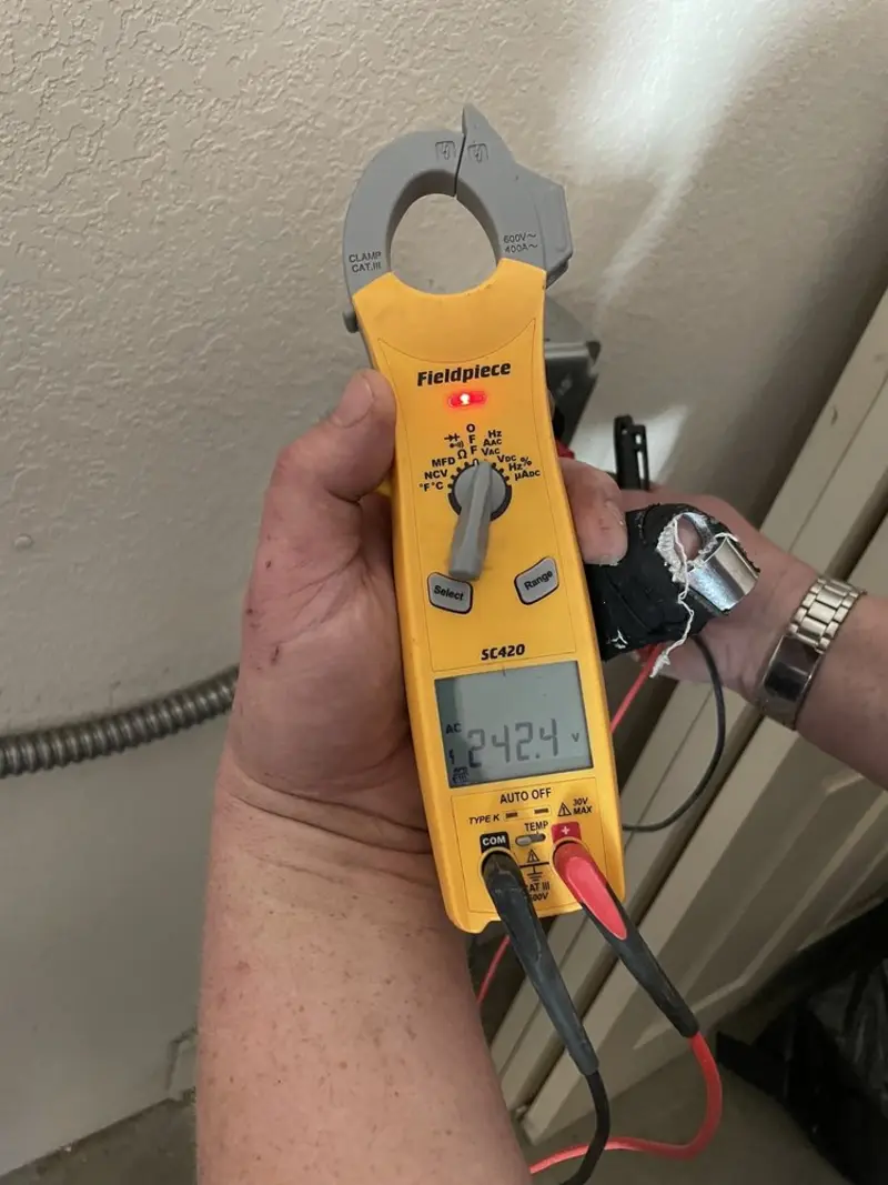 Voltage testing with clamp meter during Whole House Surge Protector in Beaver Falls